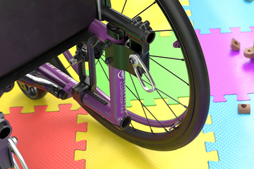 Wheelchair with improved depth adjustable back feature on a colorful puzzle mat.